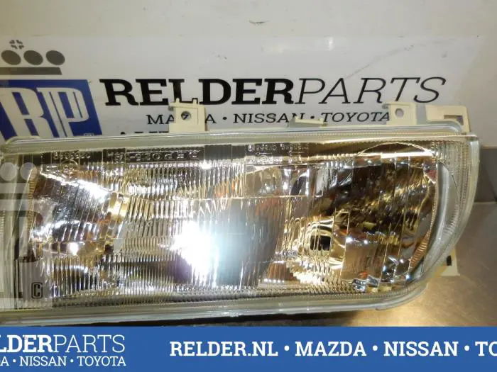 Headlight, left Nissan Primera