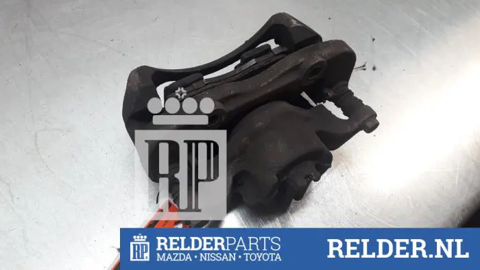 Remklauw (Tang) links-voor Nissan NV200